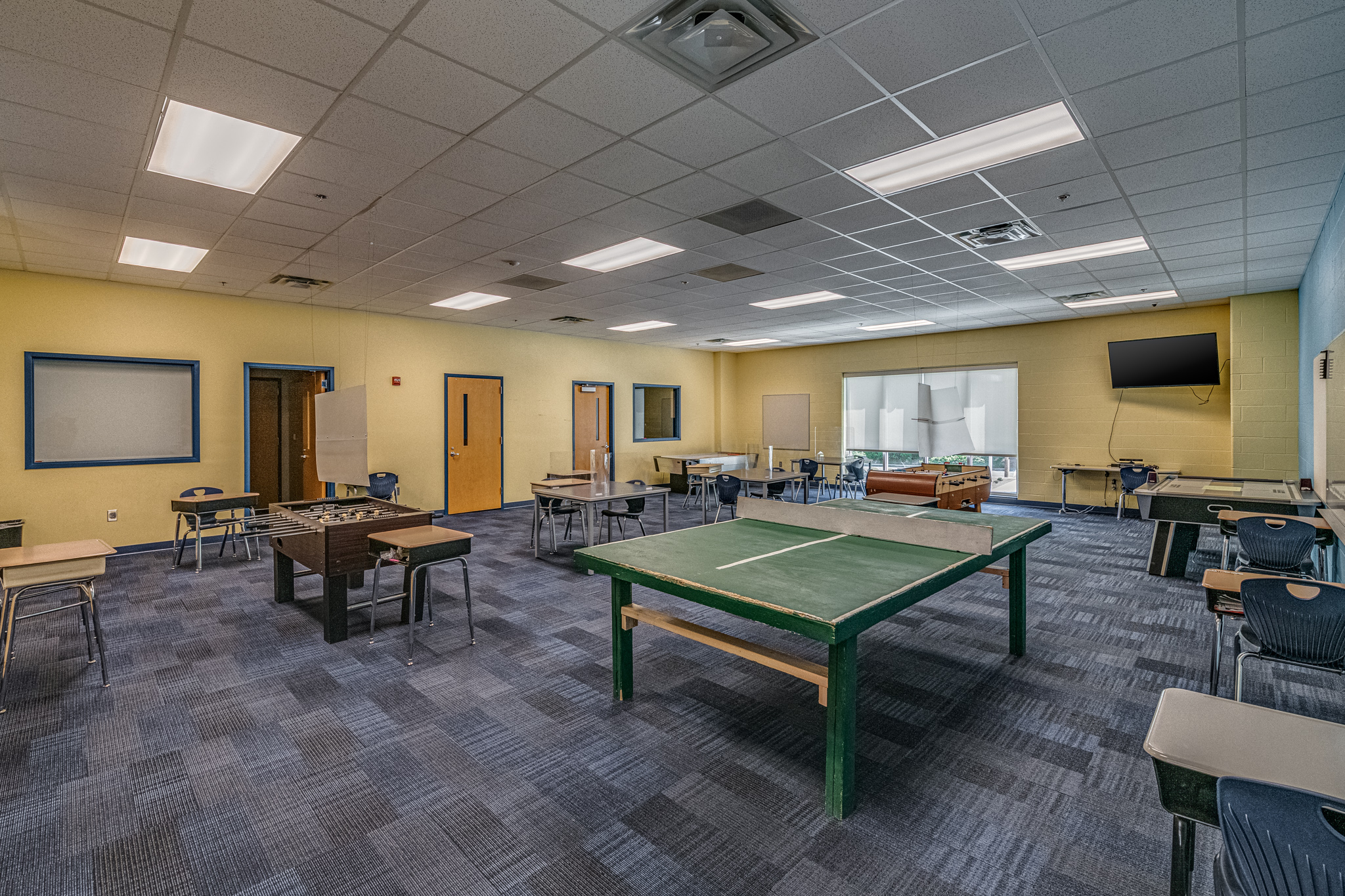A community room with a ping pong table at the Boys and Girls Club of Cabarrus County